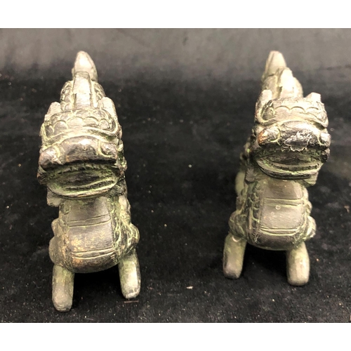 2292 - A pair of bronze Oriental dragons, 13.5cm wide, 9cm high and a pair of Oriental miniature clogs.