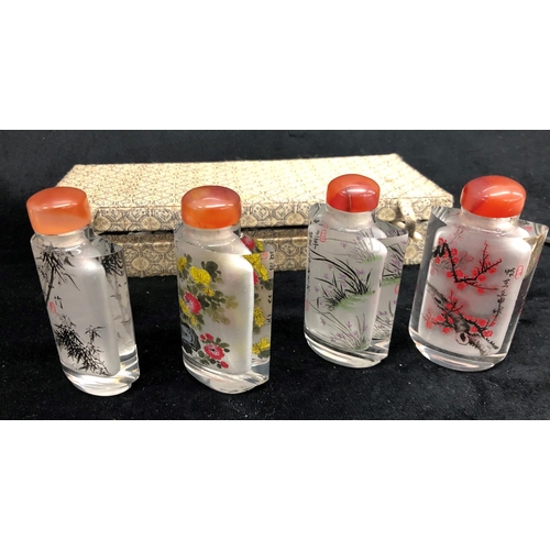 2293 - A boxed set of 4 miniature Oriental scent bottles, each 8.5cm high, 3 decorative wall plates, 15cm d... 