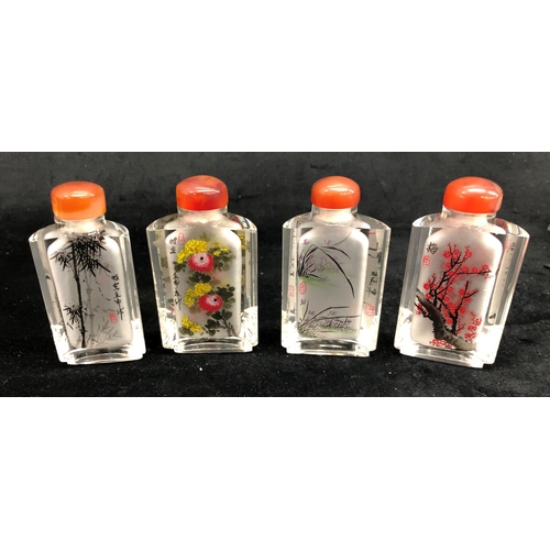 2293 - A boxed set of 4 miniature Oriental scent bottles, each 8.5cm high, 3 decorative wall plates, 15cm d... 