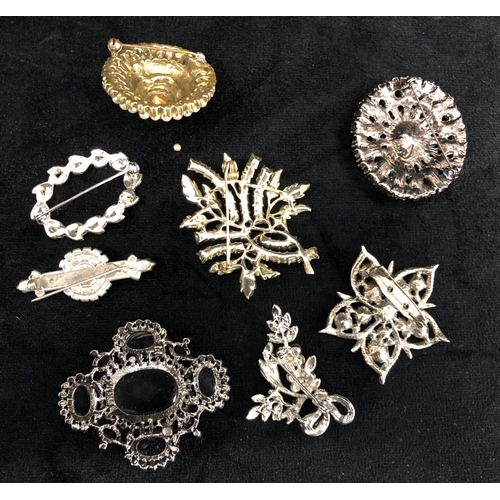 2299 - A quantity of costume jewellery including necklaces, brooches and 2 bracelets.