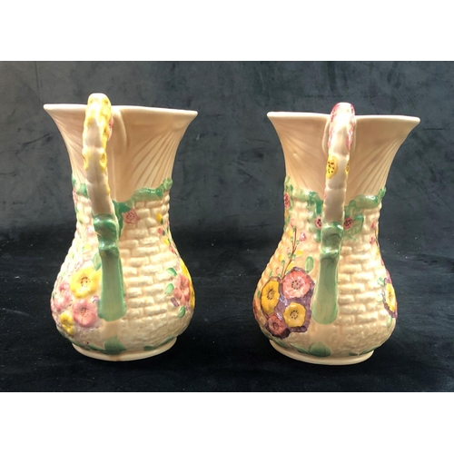 2305 - A pair of Arthur Wood Garden Wall jugs, 20.5cm high. (2)