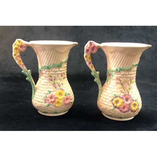 2305 - A pair of Arthur Wood Garden Wall jugs, 20.5cm high. (2)