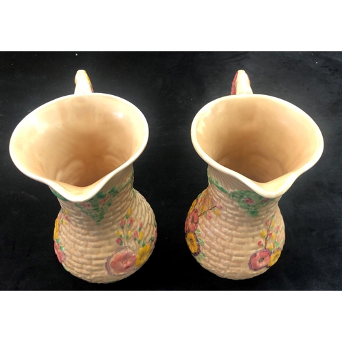 2305 - A pair of Arthur Wood Garden Wall jugs, 20.5cm high. (2)