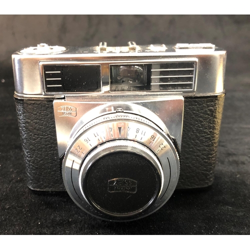 2310 - A Zeiss Ikon Contessa LK camera, no. D51800, in brown leather case, with original manual and sales r... 