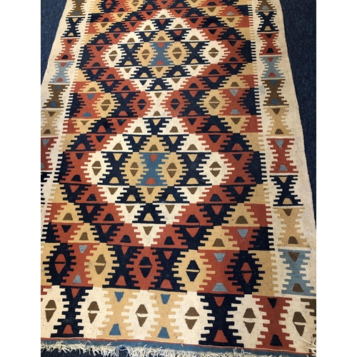 2312 - A kelim rug with multi-coloured geometric design, 115cm wide, 189cm long.