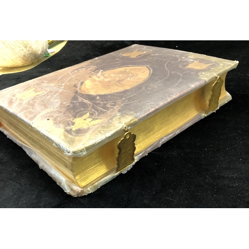 2322 - A leather bound and gilt German family bible with handwritten entries and coloured prints.