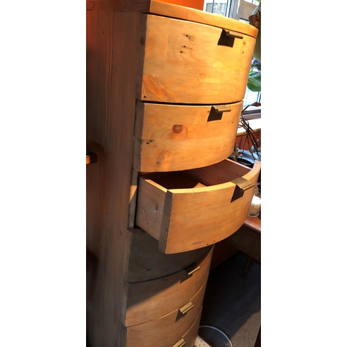 2324 - A narrow bow fronted chest of drawers, 40cm wide, 44cm deep, 139cm high overall.
This Lot is not hel... 