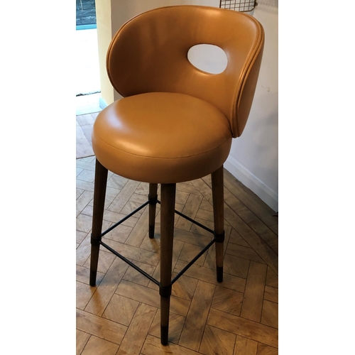 2326 - A tan brown leather bar stool on wood legs, 48cm wide, 45cm deep, 103.5cm high. This Lot is not held... 