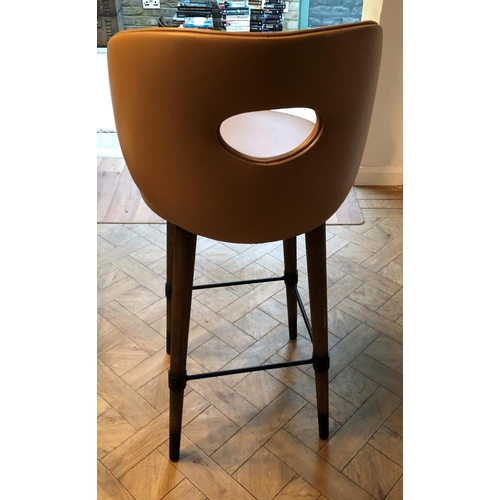 2326 - A tan brown leather bar stool on wood legs, 48cm wide, 45cm deep, 103.5cm high. This Lot is not held... 