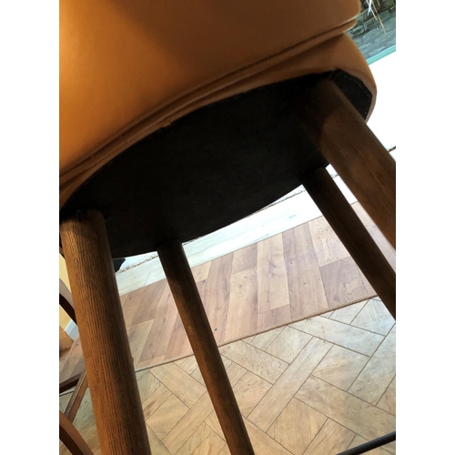 2326 - A tan brown leather bar stool on wood legs, 48cm wide, 45cm deep, 103.5cm high. This Lot is not held... 