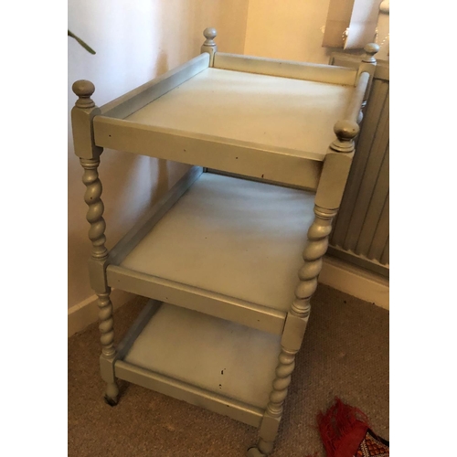 2332 - A grey painted wooden trolley, 3 shelves and on castor wheels, 61.5cm wide, 42.5cm deep, 80cm high. ... 