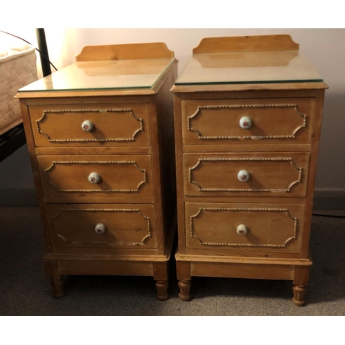 2335 - A pair of pine bedside cabinets with 3 drawers and ceramic floral patterned handles, glass to top, 3... 