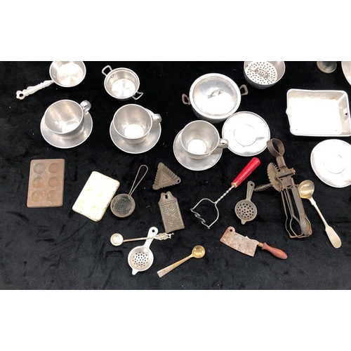 2181 - A large quantity of aluminium toy kitchen pots and pans and various other toy kitchen items, some st... 