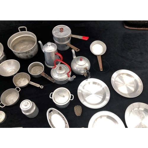 2181 - A large quantity of aluminium toy kitchen pots and pans and various other toy kitchen items, some st... 