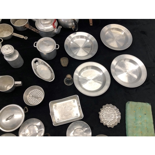 2181 - A large quantity of aluminium toy kitchen pots and pans and various other toy kitchen items, some st... 