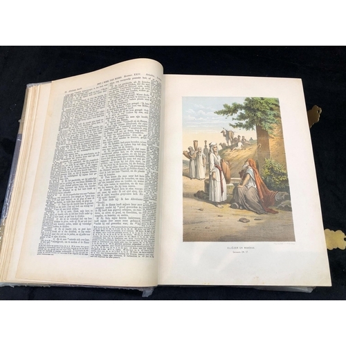 2322 - A leather bound and gilt German family bible with handwritten entries and coloured prints.