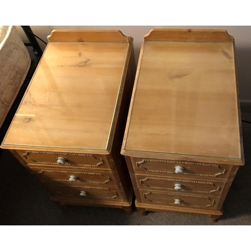 2335 - A pair of pine bedside cabinets with 3 drawers and ceramic floral patterned handles, glass to top, 3... 