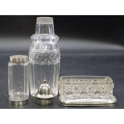 3351 - A cut glass round sifter with silver top, a square cut glass mustard pot with silver top and a cut g... 