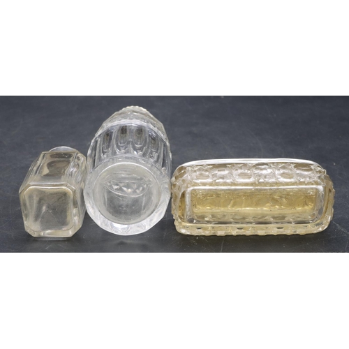 3351 - A cut glass round sifter with silver top, a square cut glass mustard pot with silver top and a cut g... 