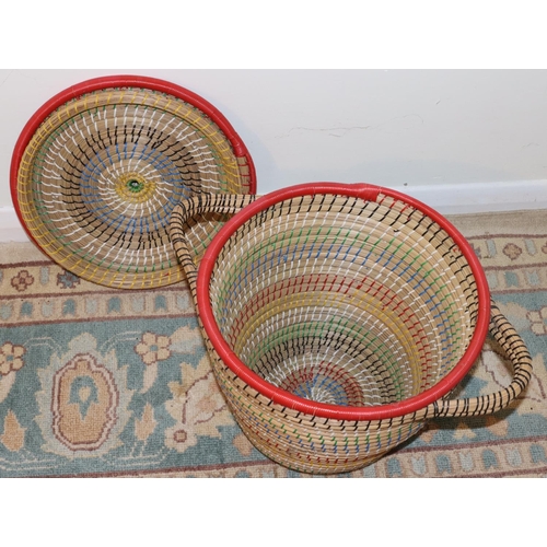 3021 - A modern multi-coloured 2-handled basket with lid, 37cm high, 36cm diameter. (This item is not held ... 