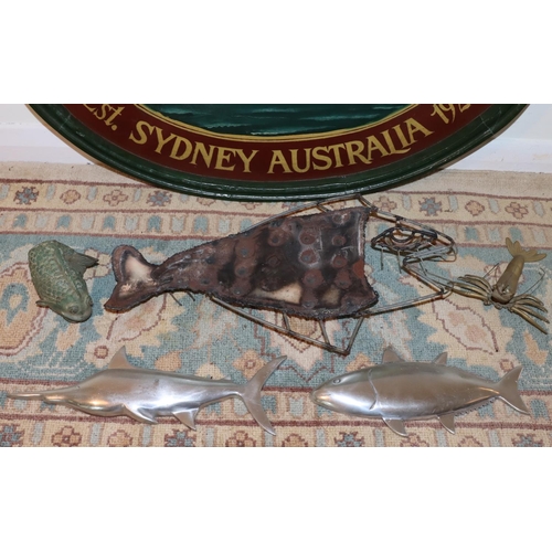 3023 - An oval wall hanging labelled International Dolphin Club Sydney Australia 1924, 77 x 54cm, a metalli... 