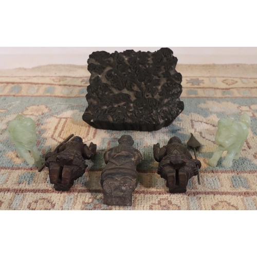 3070 - A pair of green stone lion figures, 3 wood carved Eastern warriors and a wooden fabric block print. ... 