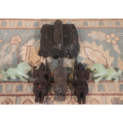 3070 - A pair of green stone lion figures, 3 wood carved Eastern warriors and a wooden fabric block print. ... 