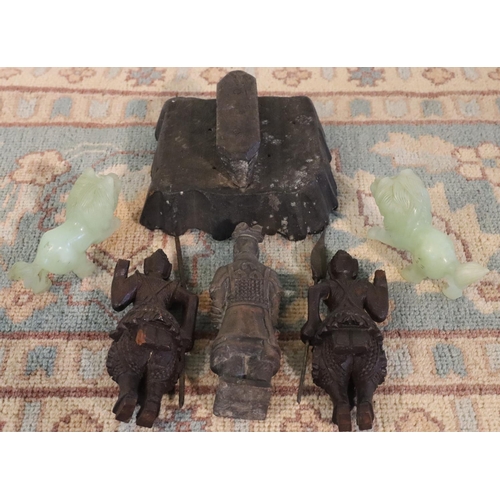 3070 - A pair of green stone lion figures, 3 wood carved Eastern warriors and a wooden fabric block print. ... 