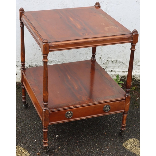 3086 - A reproduction yew 2-tiered occasional table with small drawer and brass handles, on castors 45 x45c... 