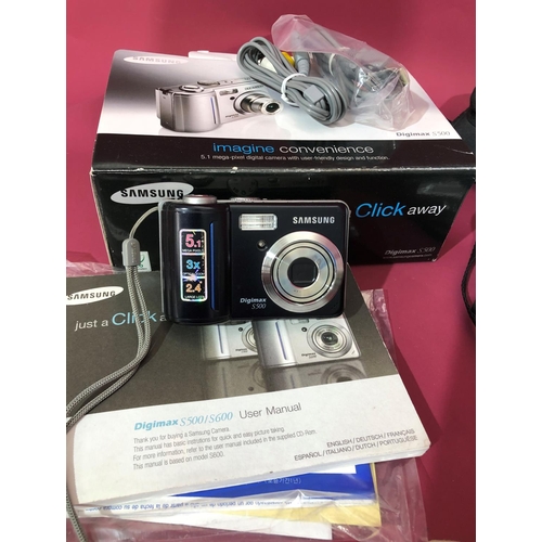 3099 - A quantity of various cameras including a Samsung Digimax S500 with box and manual, Pentax Optio S60... 