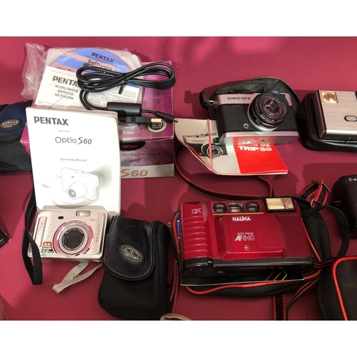 3099 - A quantity of various cameras including a Samsung Digimax S500 with box and manual, Pentax Optio S60... 