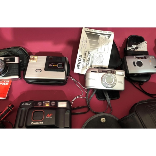 3099 - A quantity of various cameras including a Samsung Digimax S500 with box and manual, Pentax Optio S60... 