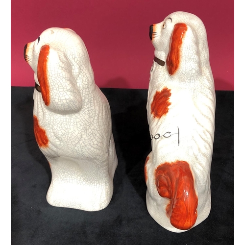 3101 - A pair of reproduction Staffordshire style dogs, 22cm high.