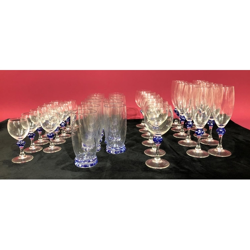 3102 - A set of glasses with blue and white detail, 10 champagne glasses 19cm high, 6 wine glasses 15.3cm h... 