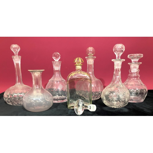 3105 - 7 glass decanters with stoppers and 1 odd glass stopper, tallest 23.5cm high