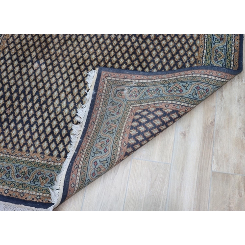 3119 - A black, grey, green, cream and red rug, 173cm wide, 252cm long. (This item is not held by PF Windib... 