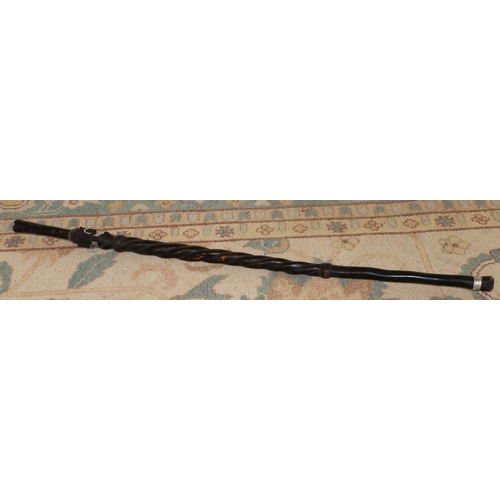 3125 - An ebonised African tribal stick 92cm long. (This item is not held by PF Windibank - please call pri... 