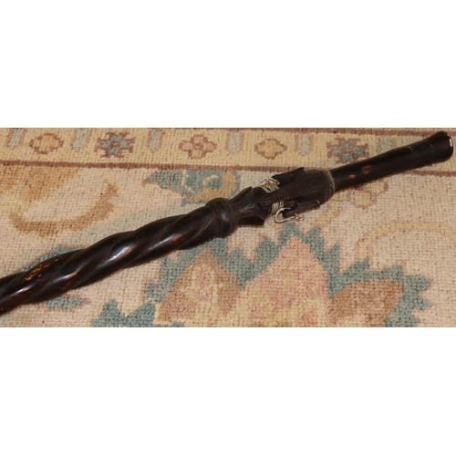 3125 - An ebonised African tribal stick 92cm long. (This item is not held by PF Windibank - please call pri... 