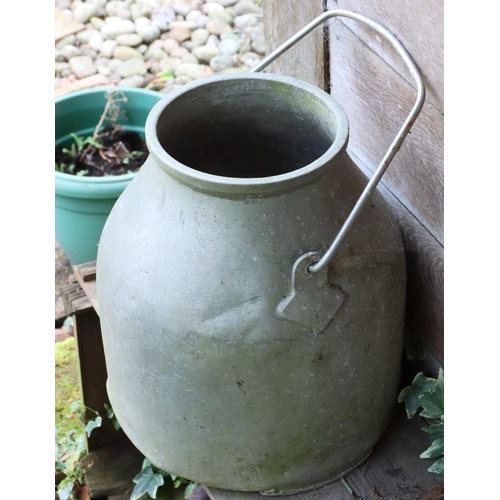 3145 - A metal milk urn with swing handle, 36cm high excluding handle. (This item is not held by PF Windiba... 