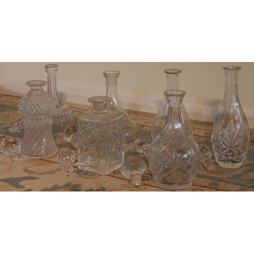 3153 - A quantity of various cut glass and clear glass decanters all with stoppers, tallest 33cm high. (Thi... 