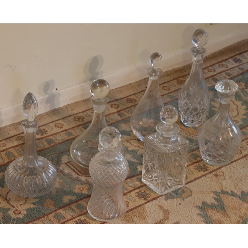 3153 - A quantity of various cut glass and clear glass decanters all with stoppers, tallest 33cm high. (Thi... 