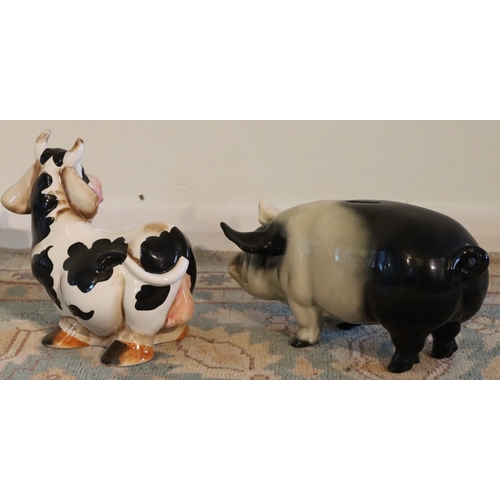 3155 - A Swiss souvenir cow money box and a pig money box. (2) (This item is not held by PF Windibank - ple... 