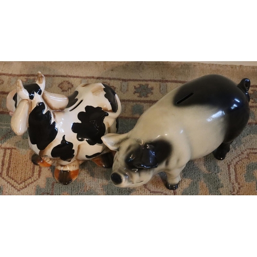 3155 - A Swiss souvenir cow money box and a pig money box. (2) (This item is not held by PF Windibank - ple... 