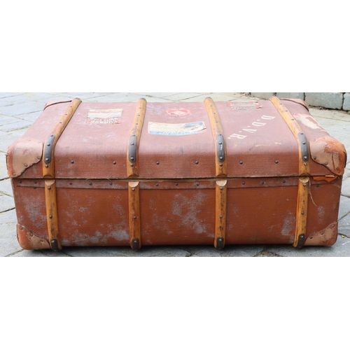 3170 - A brown trunk with leather handles, brass locks, enclosing interior lift out tray, 93cm wide overall... 