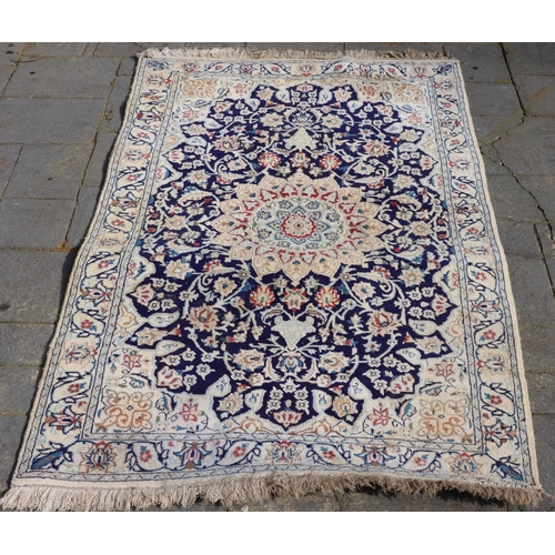 3171 - A rug on cream ground with centre medallion and blue, red and brown pattern, 120cm wide, 208cm long.... 