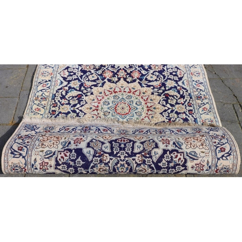 3171 - A rug on cream ground with centre medallion and blue, red and brown pattern, 120cm wide, 208cm long.... 