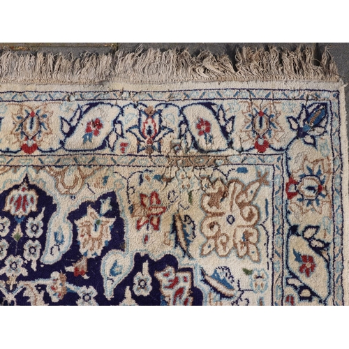 3171 - A rug on cream ground with centre medallion and blue, red and brown pattern, 120cm wide, 208cm long.... 