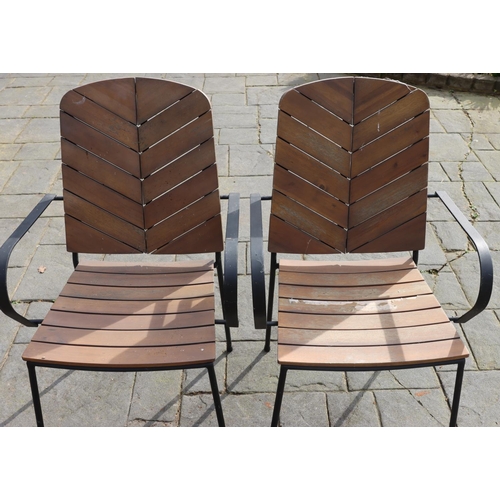 3174 - 2 black metallic chairs with wood slatted seats and backs, 56cm wide, 52cm deep, 193.5cm high. (This... 