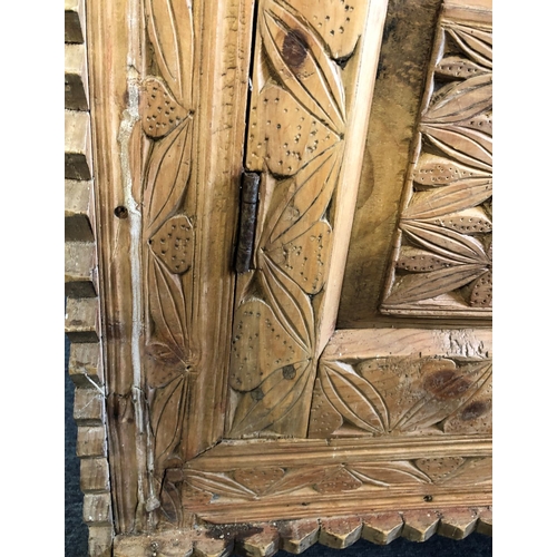 3181 - A small pine door and frame with carved detail and metal handle, 72cm wide, 107.5cm high, 54cm wide,... 