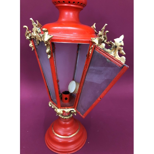 3225 - A red painted table lantern, 54cm high overall